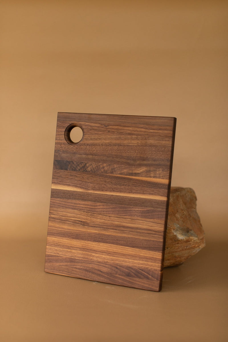 http://acornblufffarms.com/cdn/shop/products/handcrafted-walnut-cutting-board-by-frankie-mcwhirt-10-x-1625-514427_1200x1200.jpg?v=1667780092